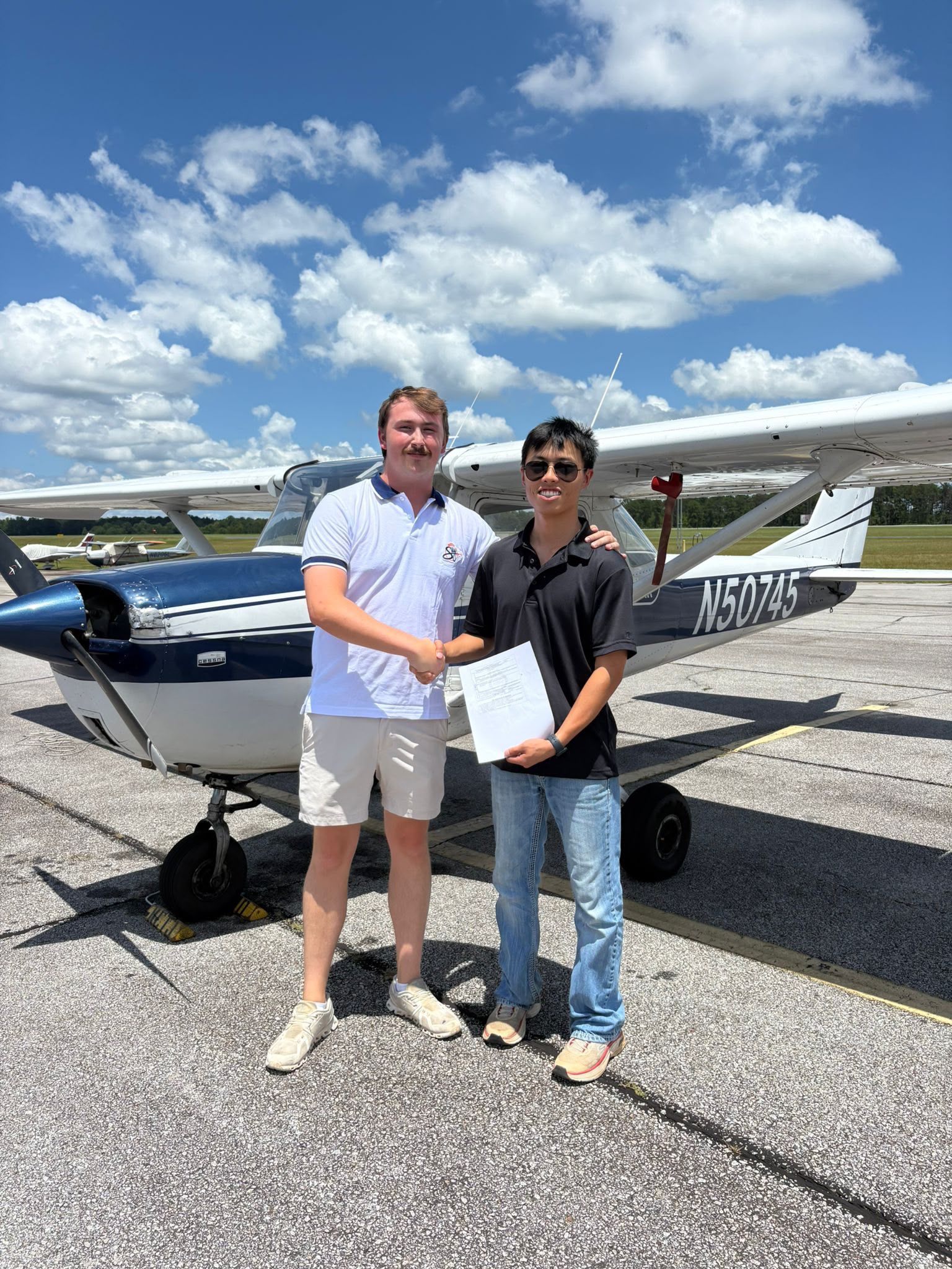 Student and Cessna 150 on the tarmac during flight training