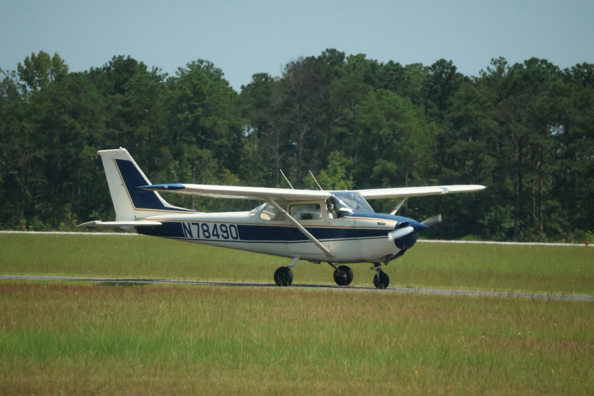 Cessna 172 soaring through clear blue skies