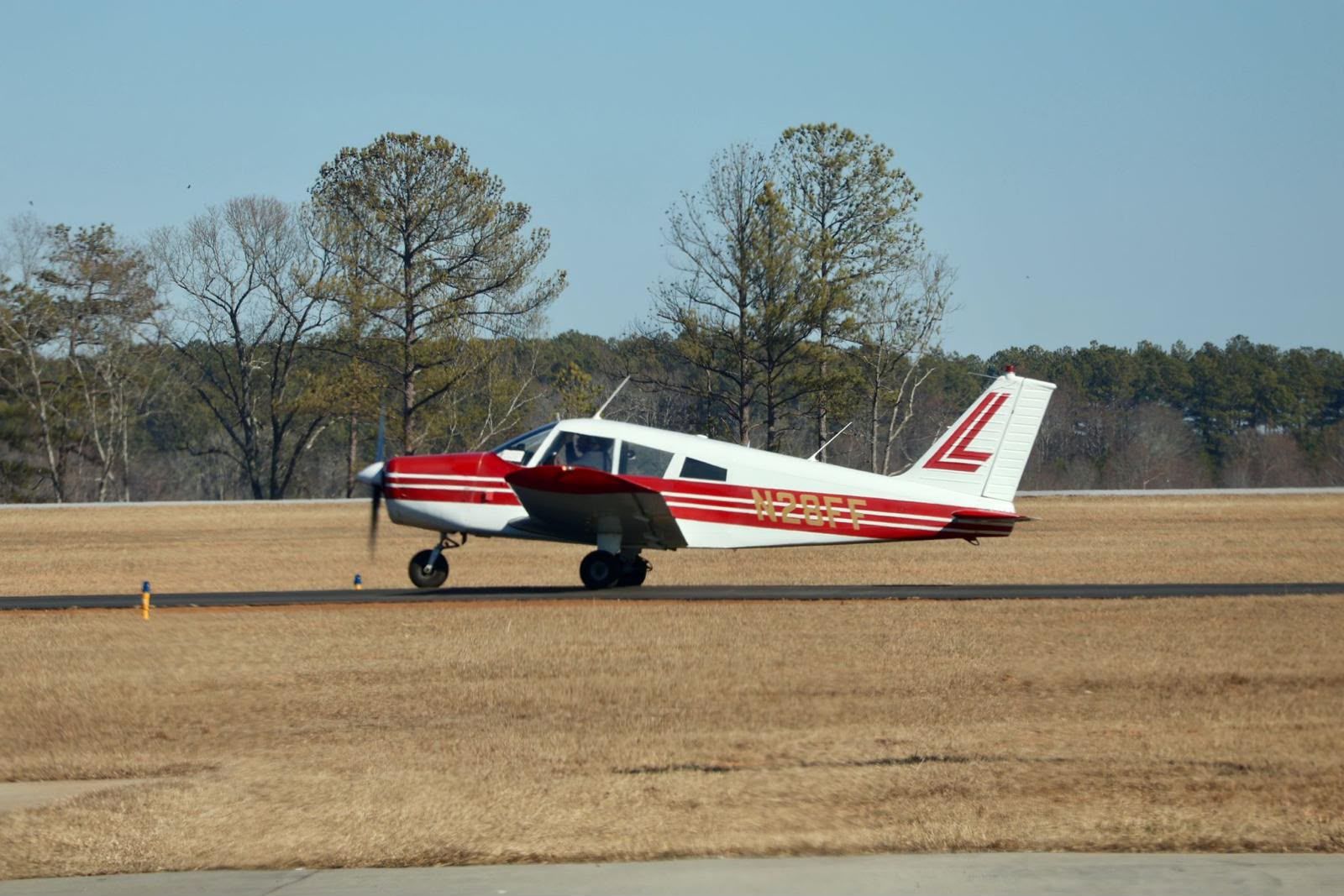 Piper PA-28 Cherokee on the runway, a classic training aircraft